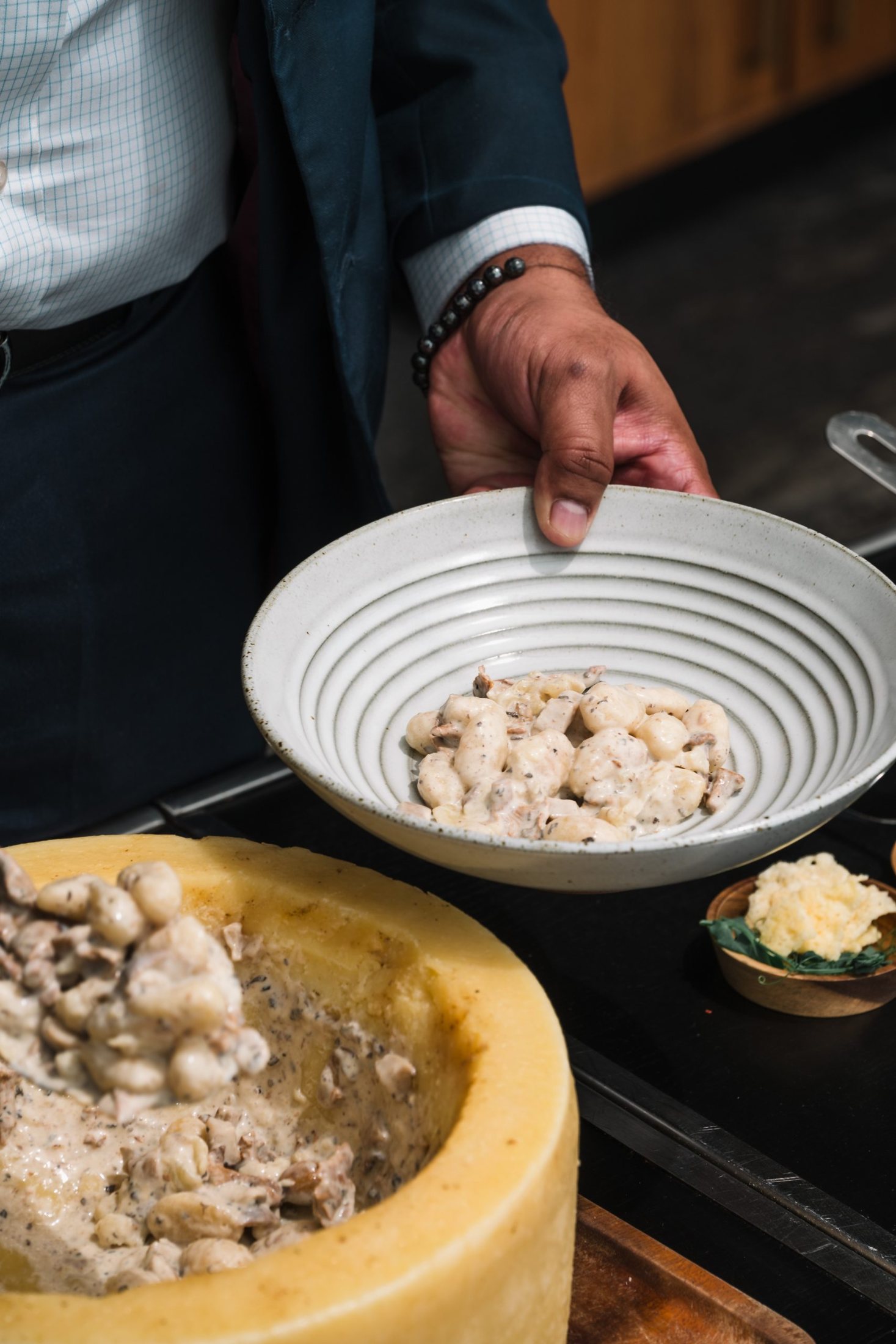 Gnocchi finished tableside in a cheese wheel at FIRE